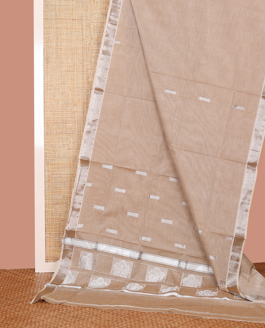 Pale Brown Kerala Saree, Lightly Embellished with Zari Buttas on Its Body, Subtly Sparkled Bavanji Border, Pallu Depicting Intricate Designs, and Paired with a Matching Blouse
