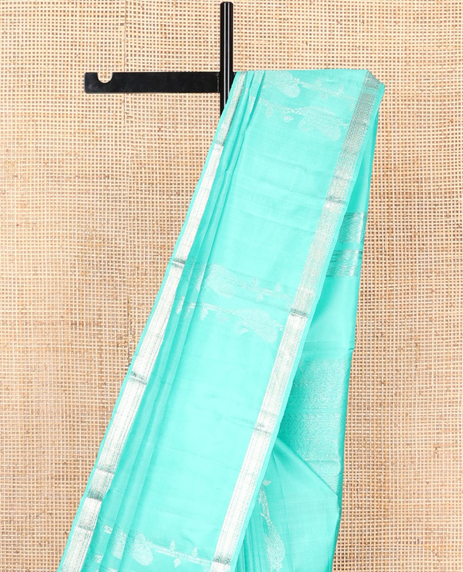 Turquoise zari design soft silk saree, zari border of kathir designs, and zari-rich pallu
