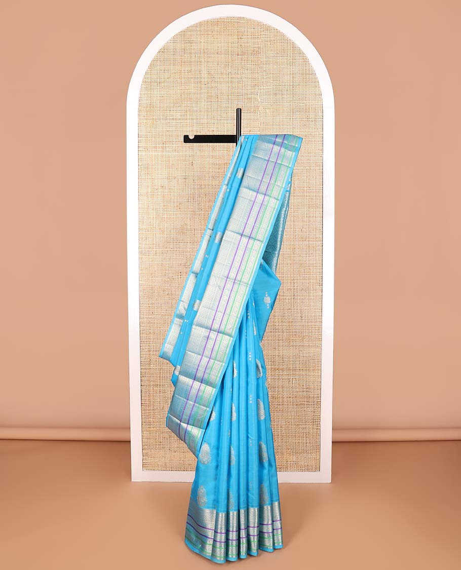 Sky blue motifs vasundhara elite silk saree with contrast border of intricate zari design & checked floral design pallu