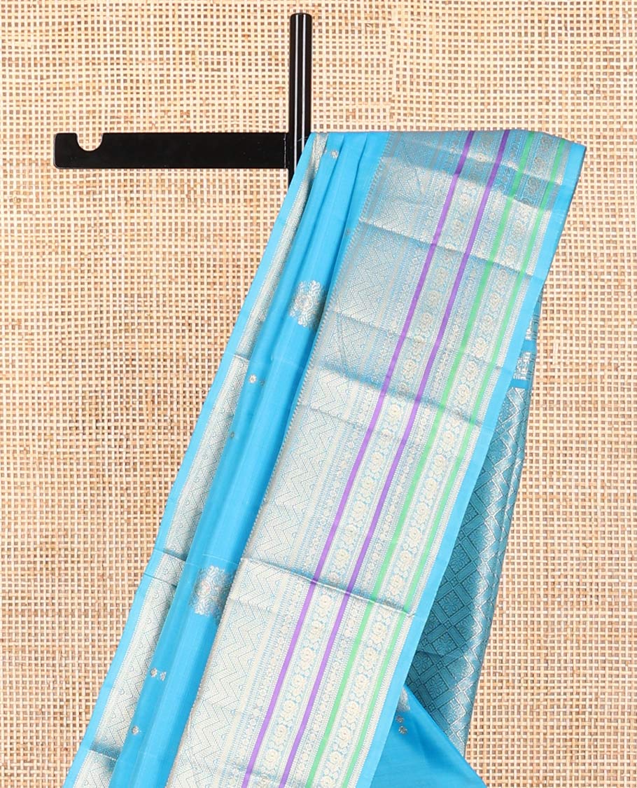 Sky blue motifs vasundhara elite silk saree with contrast border of intricate zari design & checked floral design pallu