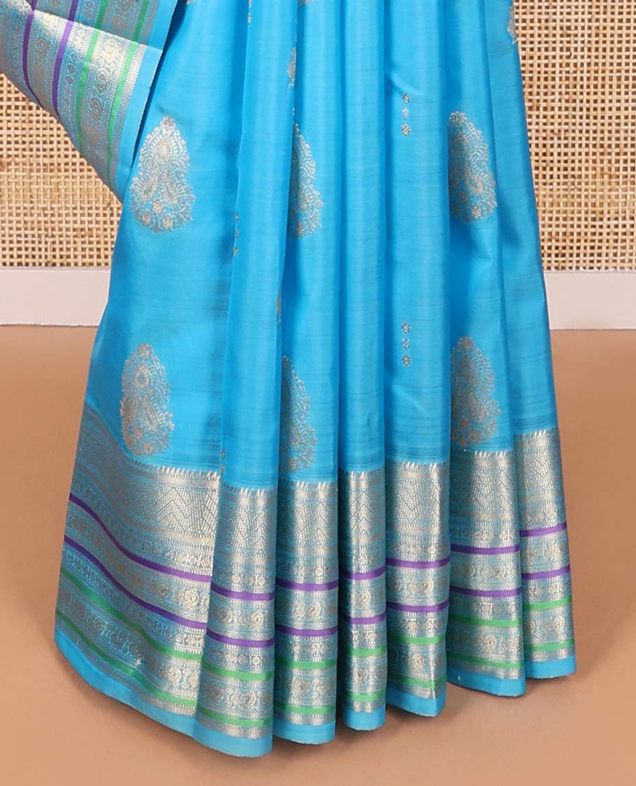 Sky blue motifs vasundhara elite silk saree with contrast border of intricate zari design & checked floral design pallu