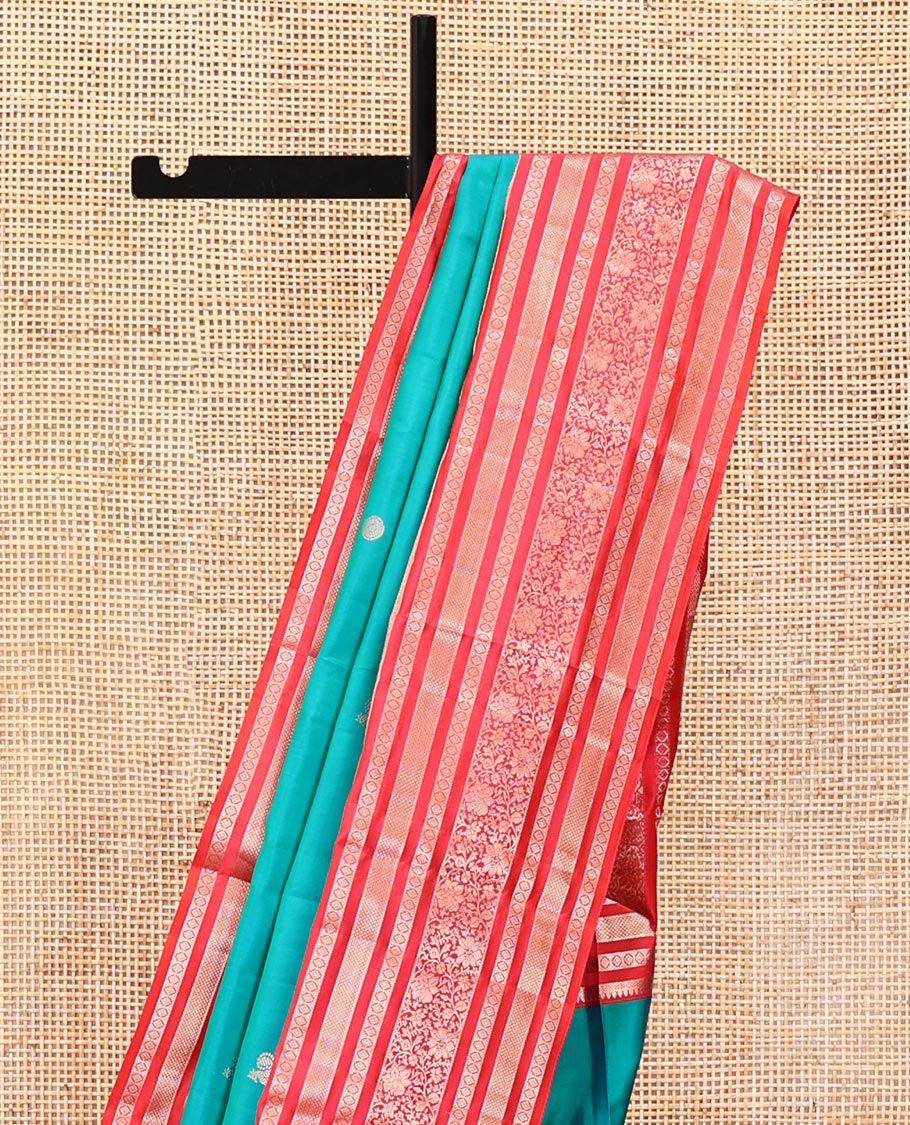 Rama Vasundhara Silk Saree, Accentuated with Zari Buttas All Over Its Body, Complemented by a Contrast Varisai Pettu Border of Thilakam, Neli, Laddu Kamalam, and Kodi Visiry Designs, Grand Pallu of Butta Enclosed Checks, and Paired with a Contrast Blouse