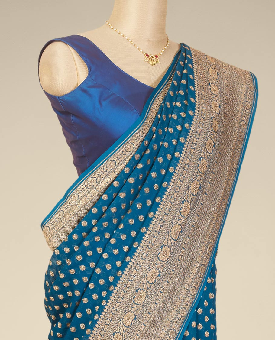 Blue floral butta banaras georgette saree with self intricare zari design border
