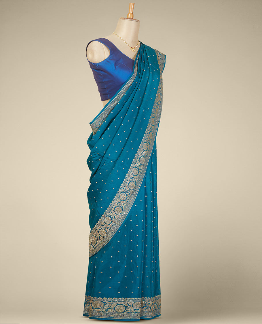 Blue floral butta crepe saree with self floral zari design border