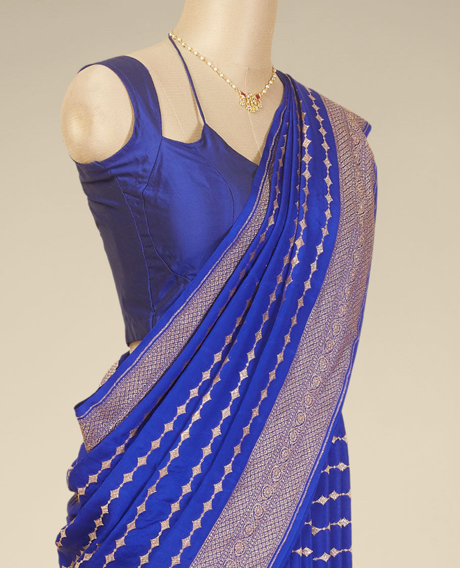 Blue striped floral design crepe with self intricate zari designb order