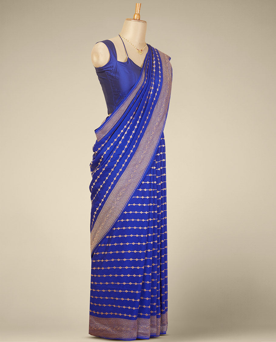 Blue striped floral design crepe with self intricate zari designb order