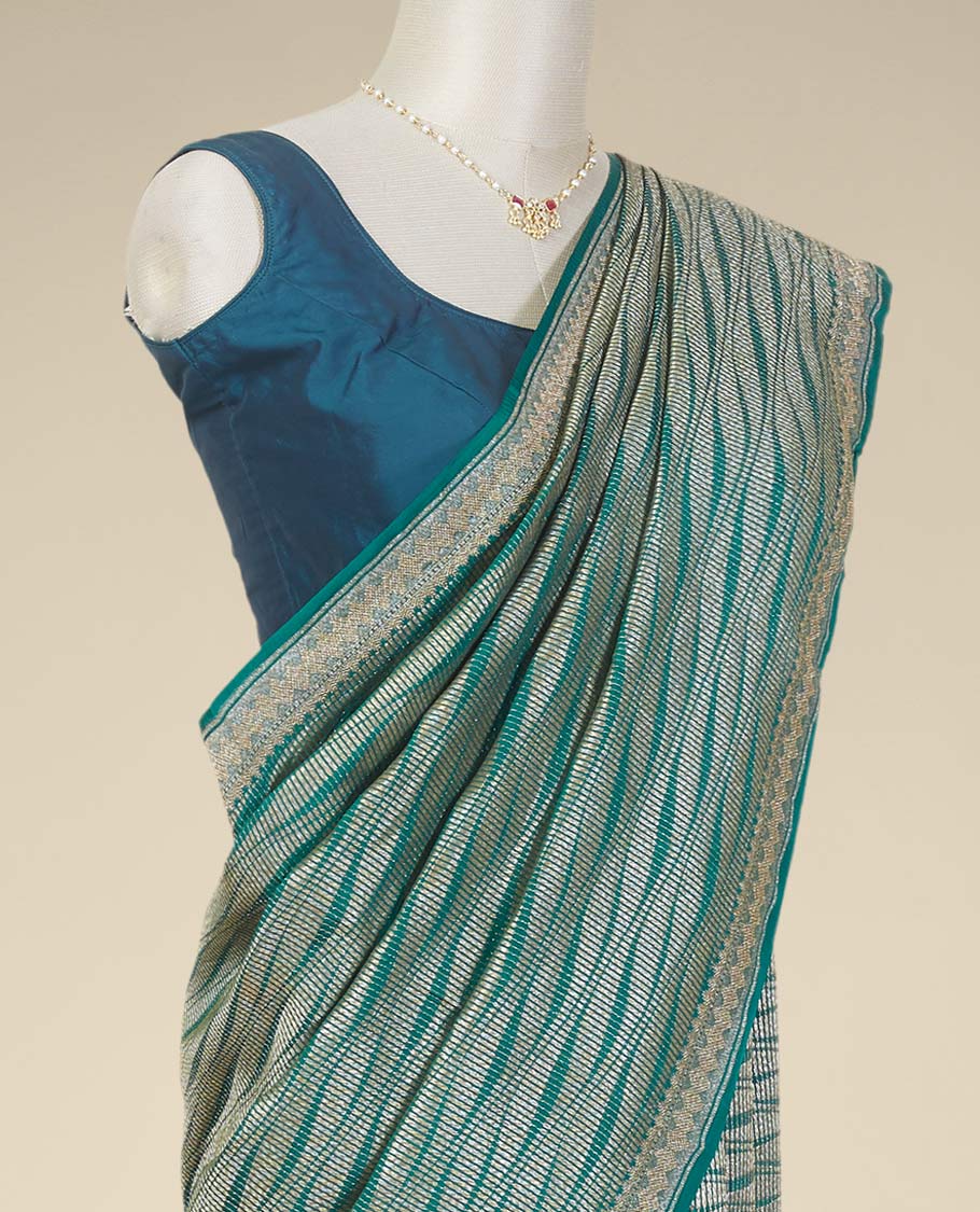 Green geometric design crepe saree with self zari design border
