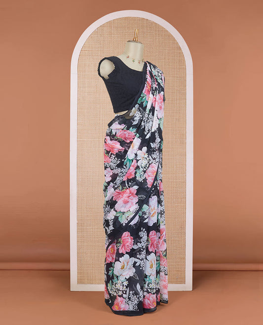 Borderless black digital printed pure chiffon saree with pink colored floral motifs, floral printed blouse