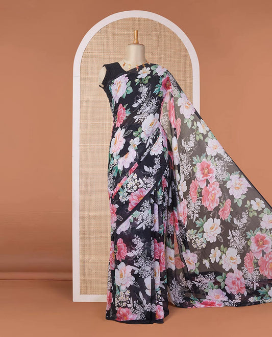 Borderless black digital printed pure chiffon saree with pink colored floral motifs, floral printed blouse
