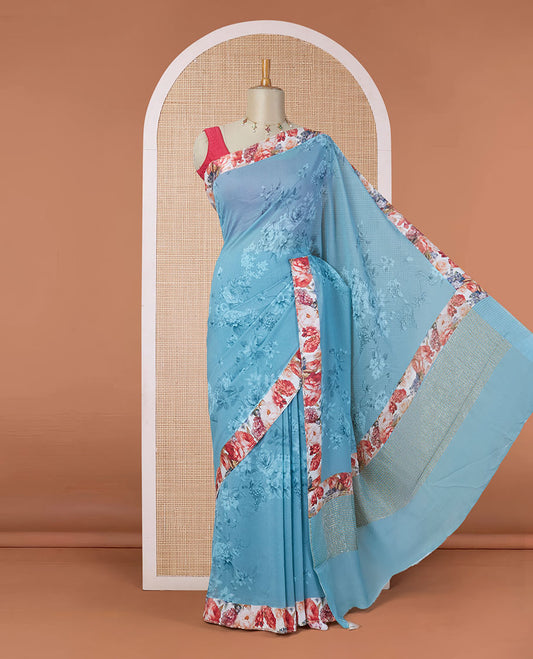 Blue floral motifs digitally printed pure chiffon saree with contrast floral printed patch border & zari striped pallu