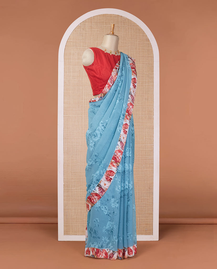 Blue floral motifs digitally printed pure chiffon saree with contrast floral printed patch border & zari striped pallu