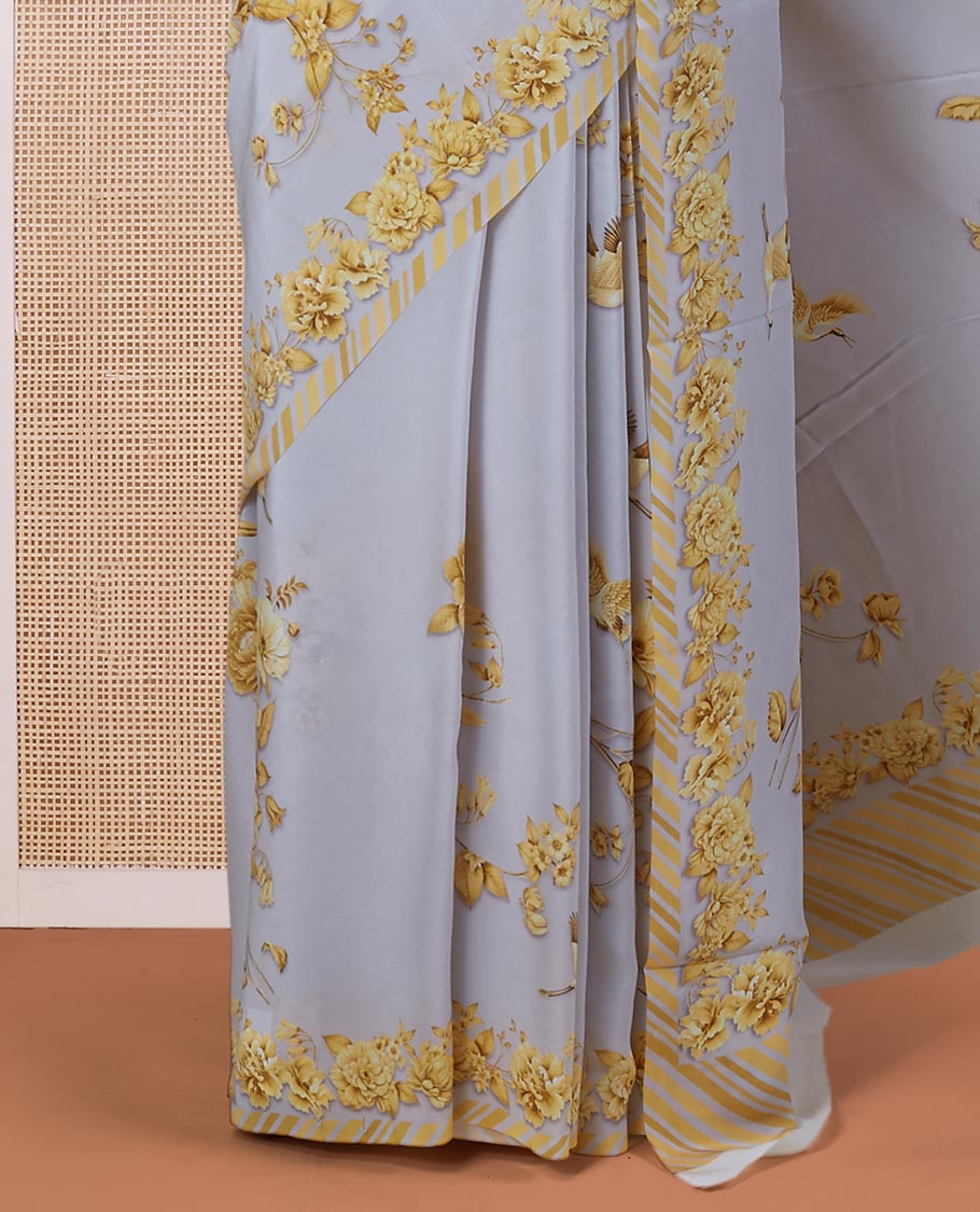 Grey digitally printed pure crepe saree with yellow floral & bird motifs & slanting stripes printed border