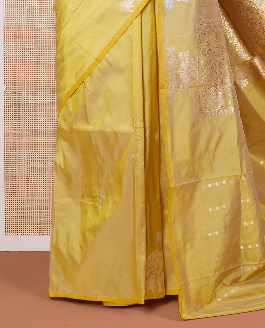 Borderless yellow katan silk saree with pichwai under a tree motifs in zari, pallu of mughal-style & dobble-style motifs