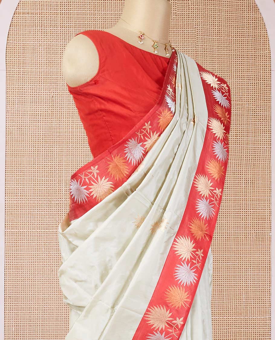 Half-white zari buttas katan silk saree, contrast floral design zari border & geometric patterned pallu