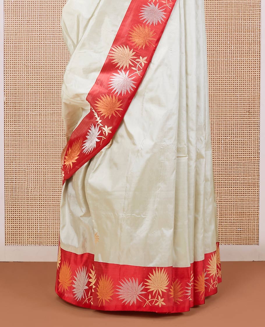 Half-white zari buttas katan silk saree, contrast floral design zari border & geometric patterned pallu