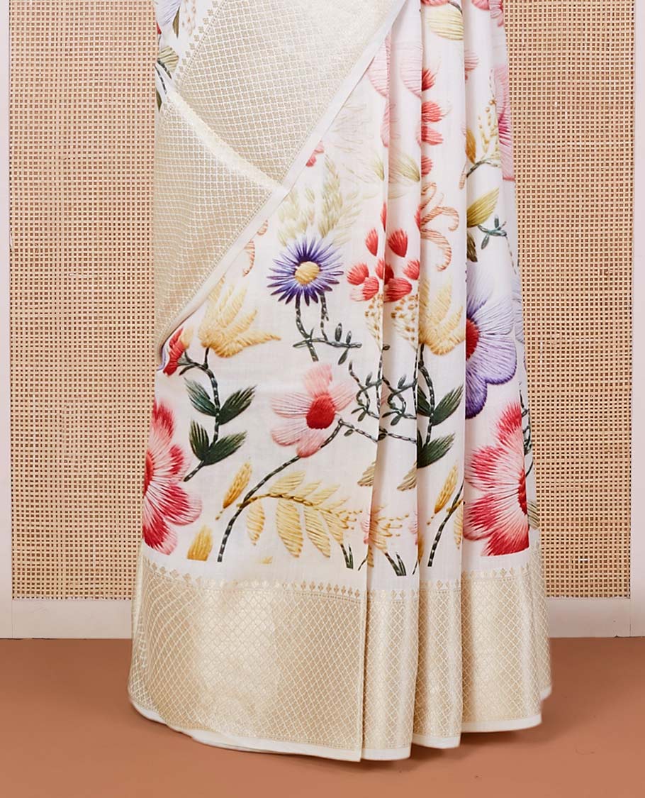 Cream digital printed chiniya silk saree with colorful floral motifs, traditional zari border & zari pallu