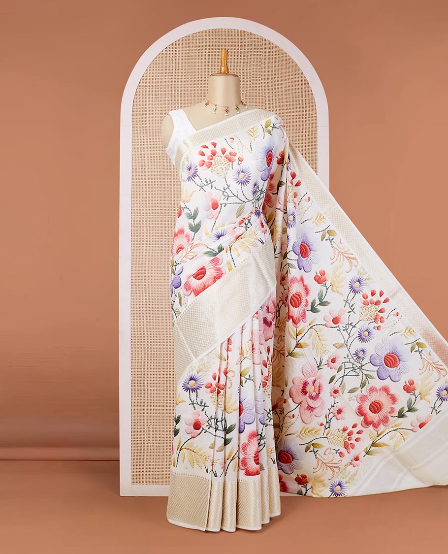 Cream digital printed chiniya silk saree with colorful floral motifs, traditional zari border & zari pallu