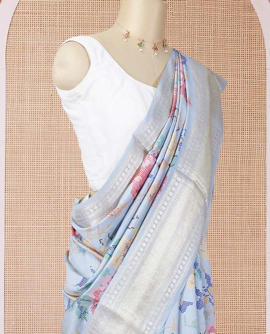 Blue printed chiniya silk saree with colorful floral motifs, traditional zari design border