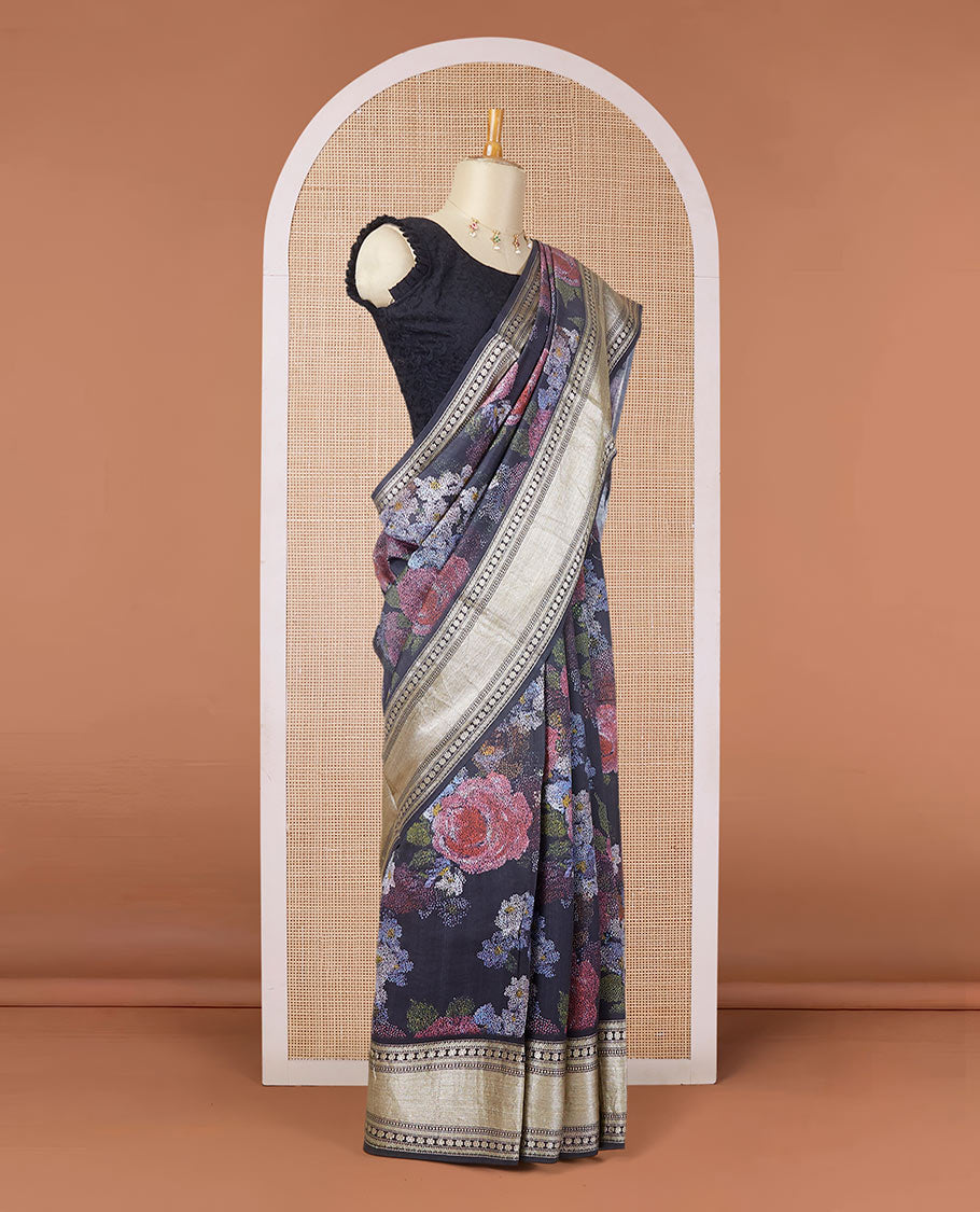 Black printed chiniya silk saree with colorful floral motifs, traditional zari design border