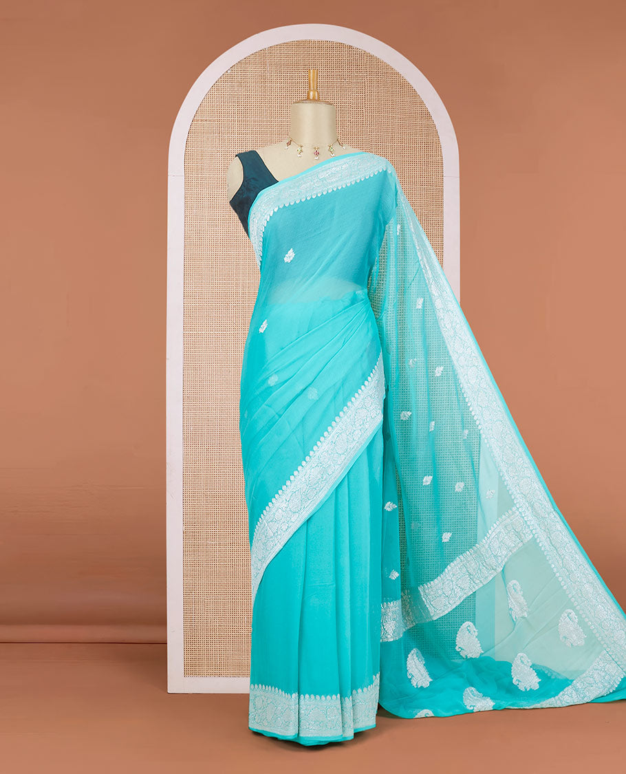 Turquoise banarasi georgette saree with zari buttas, floral creeper zari border & pallu of paisleys