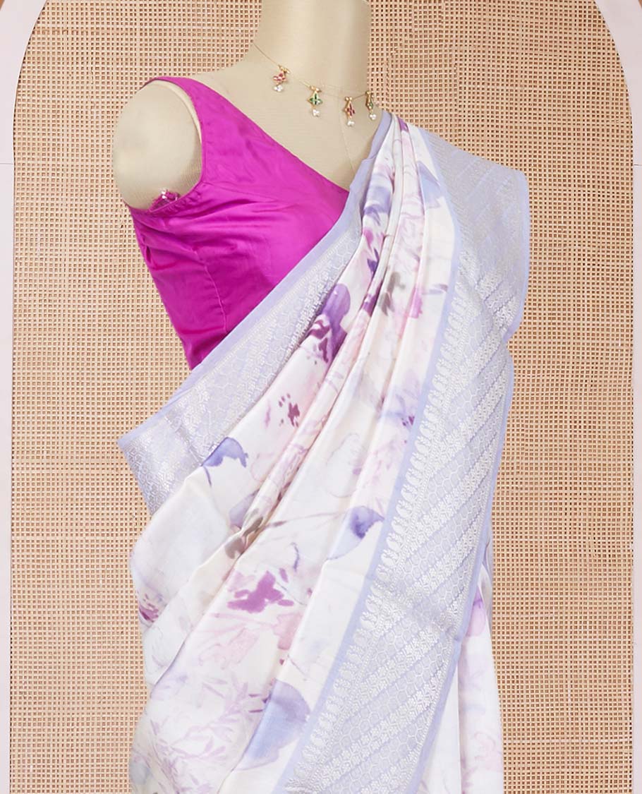 Half-white floral printed chiniya silk saree, contrast traditional zari border