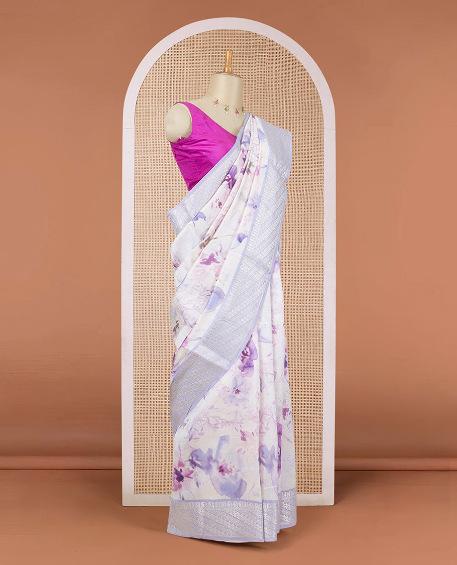 Half-white floral printed chiniya silk saree, contrast traditional zari border