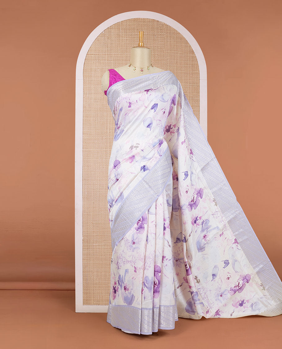 Half-white floral printed chiniya silk saree, contrast traditional zari border