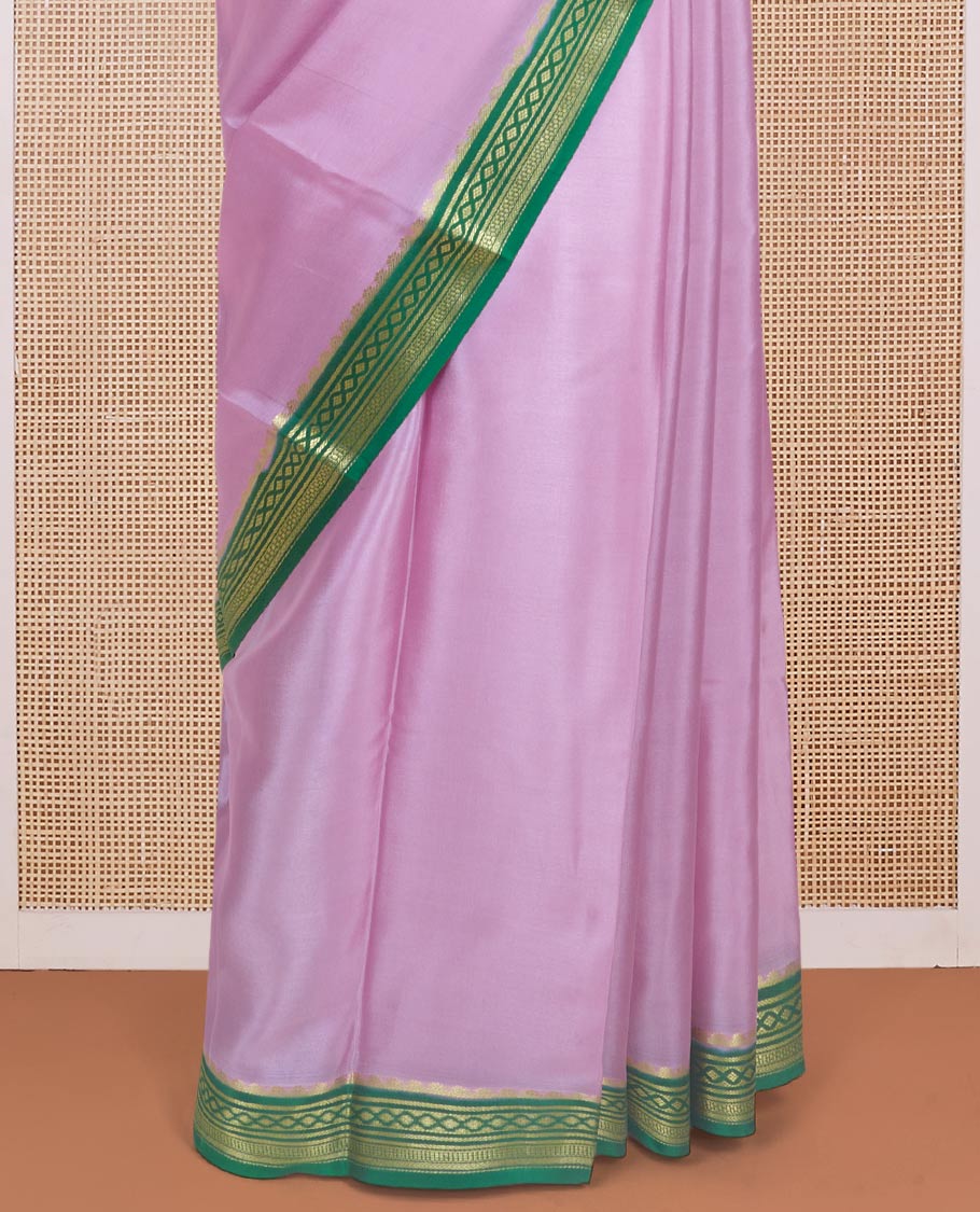 Baby pink plain Mysore silk saree with contrast geometric zari design borders and pallu of zari seer lines