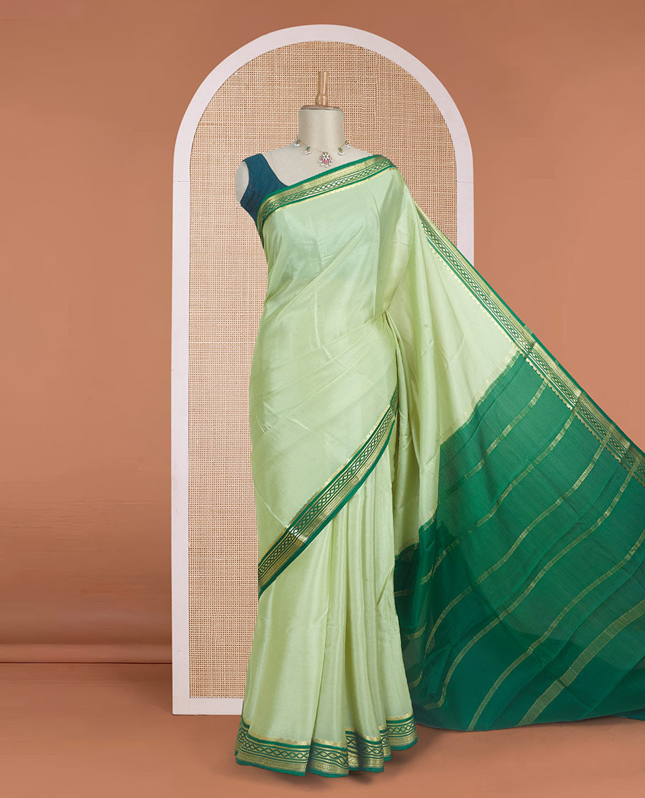 Tea green color plain Mysore silk saree with contrast geometric zari design borders and pallu of zari seer lines