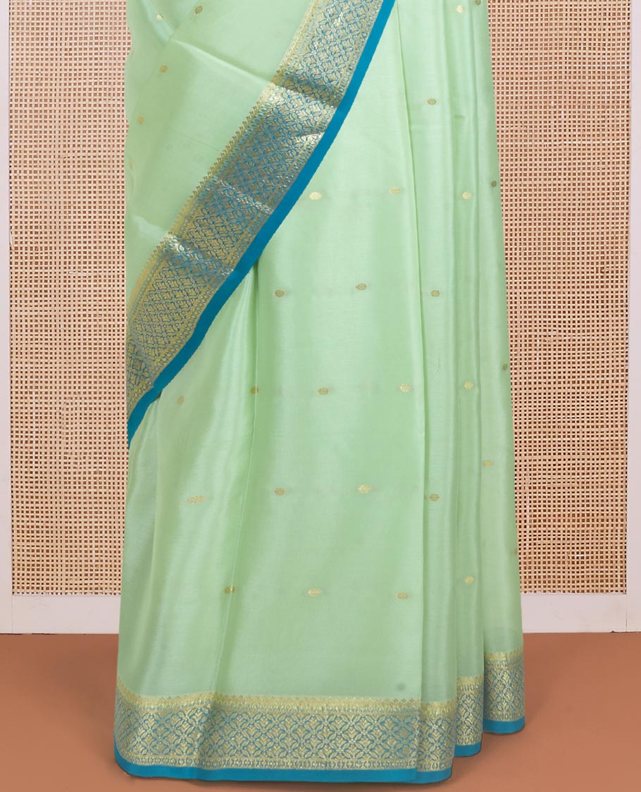 Pista green zari buttas woven Mysore silk saree, contrast jaal design zari border, and pallu adorned with jaal zari design weave