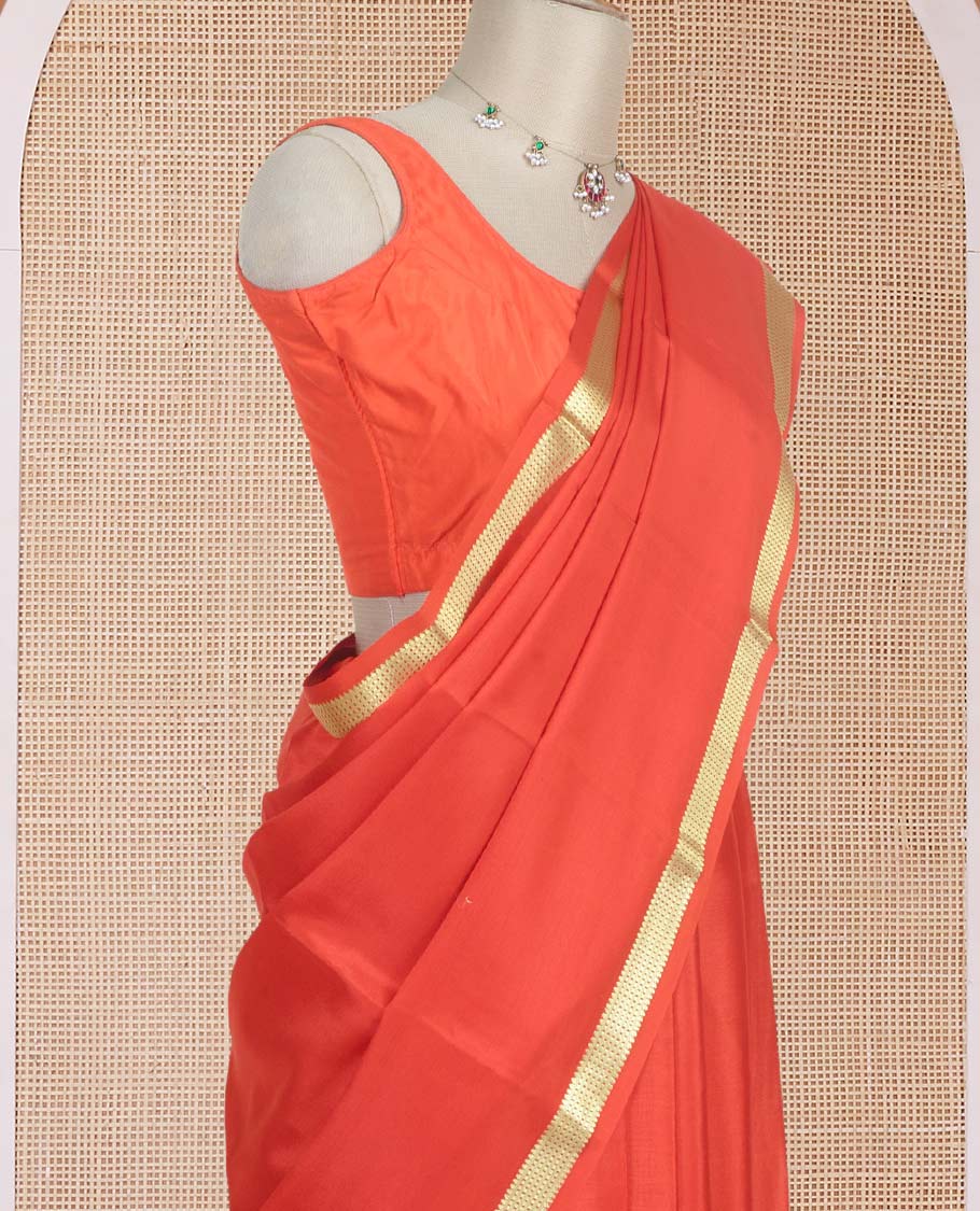 Orange plain design Mysore silk saree with traditional zari piping border, and zari striped pallu