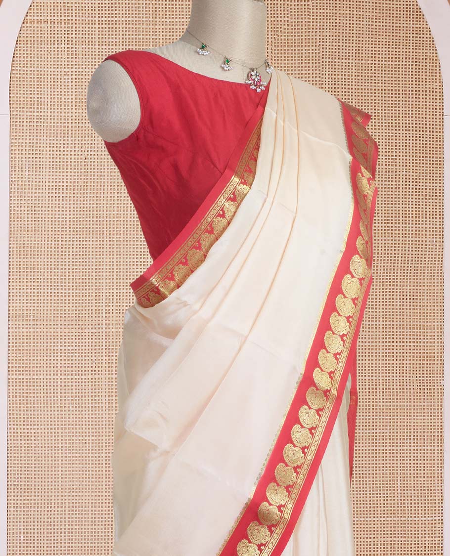 Cream plain design mysore silk saree, contrast paisley design zari border, and zari seer striped pallu