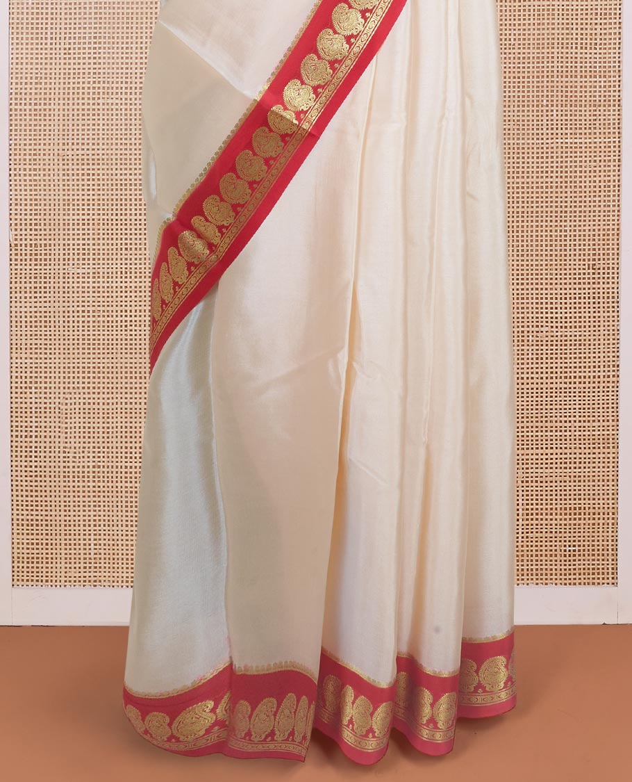 Cream plain design mysore silk saree, contrast paisley design zari border, and zari seer striped pallu
