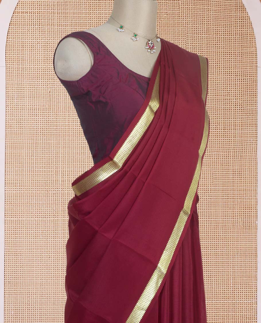 Maroon plain design Mysore silk saree with traditional zari design borders, and zari striped pallu
