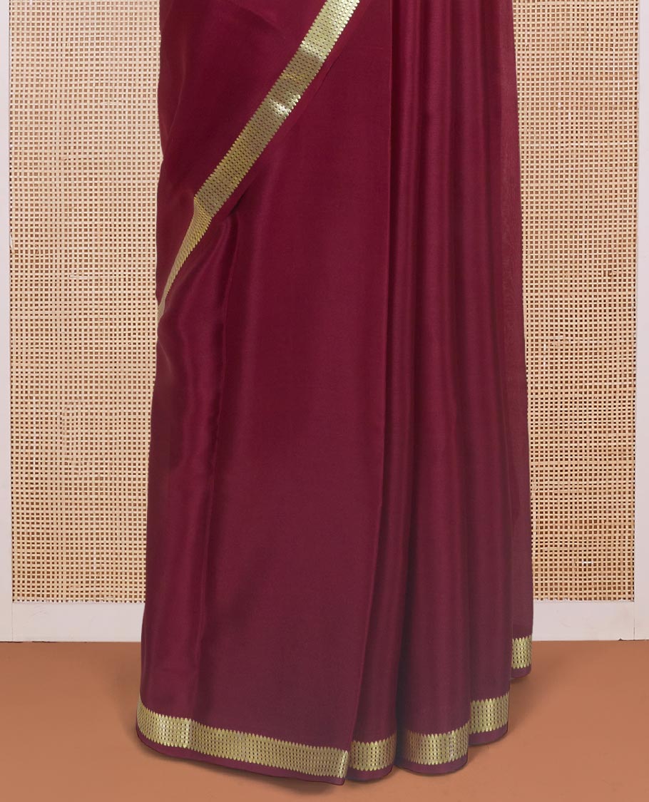 Maroon plain design Mysore silk saree with traditional zari design borders, and zari striped pallu