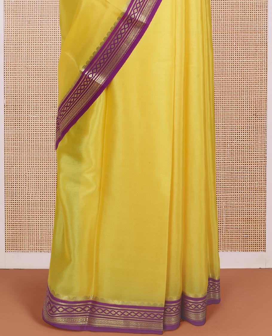 Rasamalai yellow plain Mysore silk saree with contrast geometric zari design borders and pallu of zari seer lines