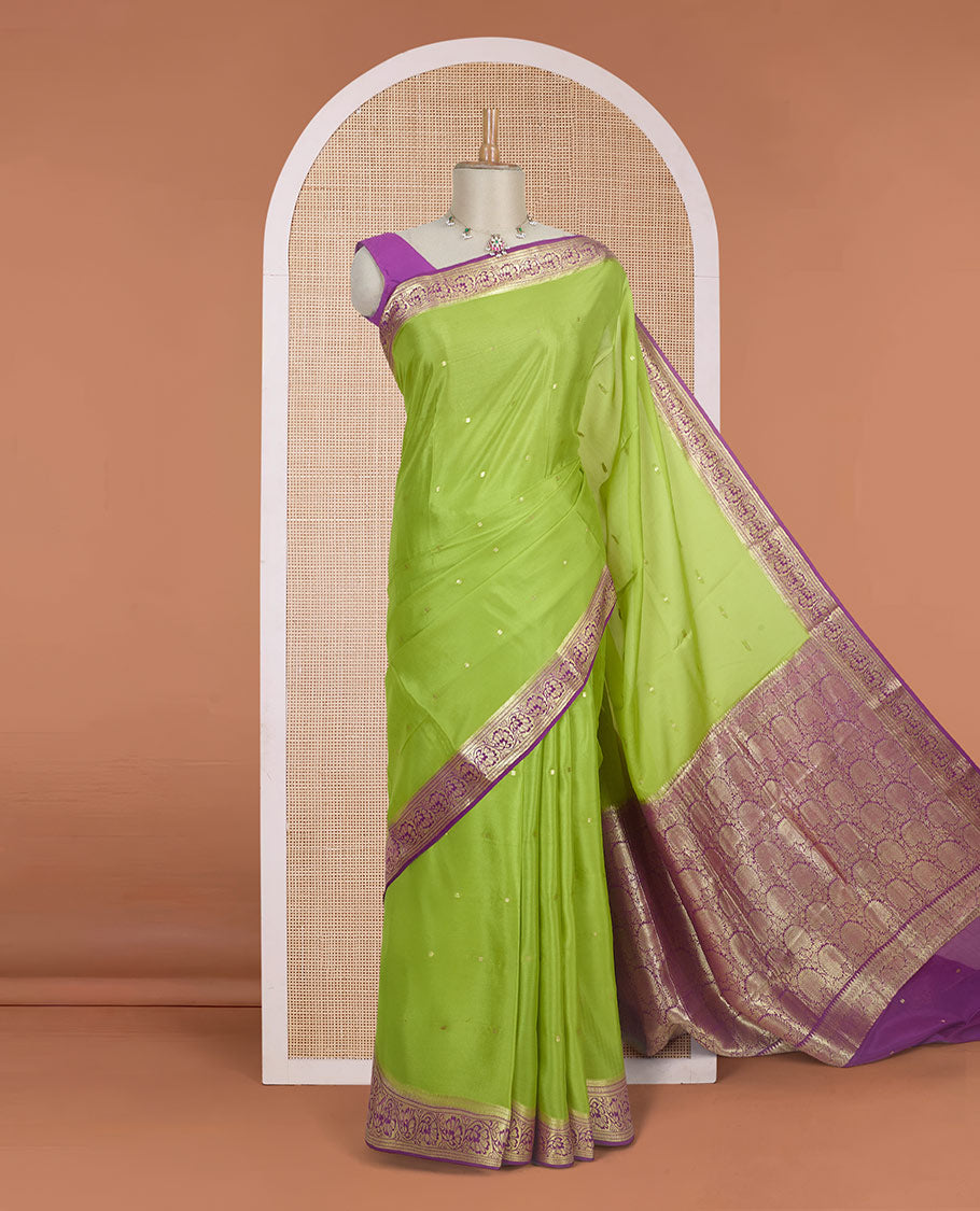 Parrot green zari buttas Mysore silk saree, contrast traditional zari border adorned with floral creeper design, and floral jaal pallu