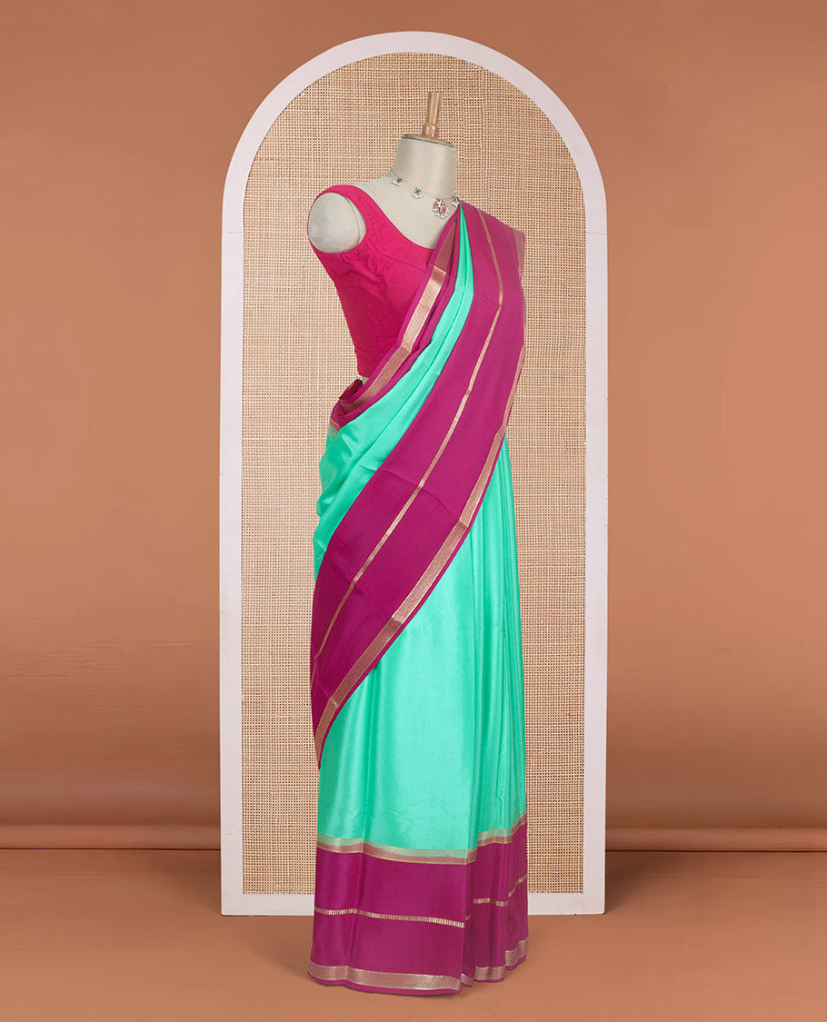 Turquoise plain design Mysore silk saree, contrast rettai pettu borders of zari designs, and pallu of zari stripes & temple design
