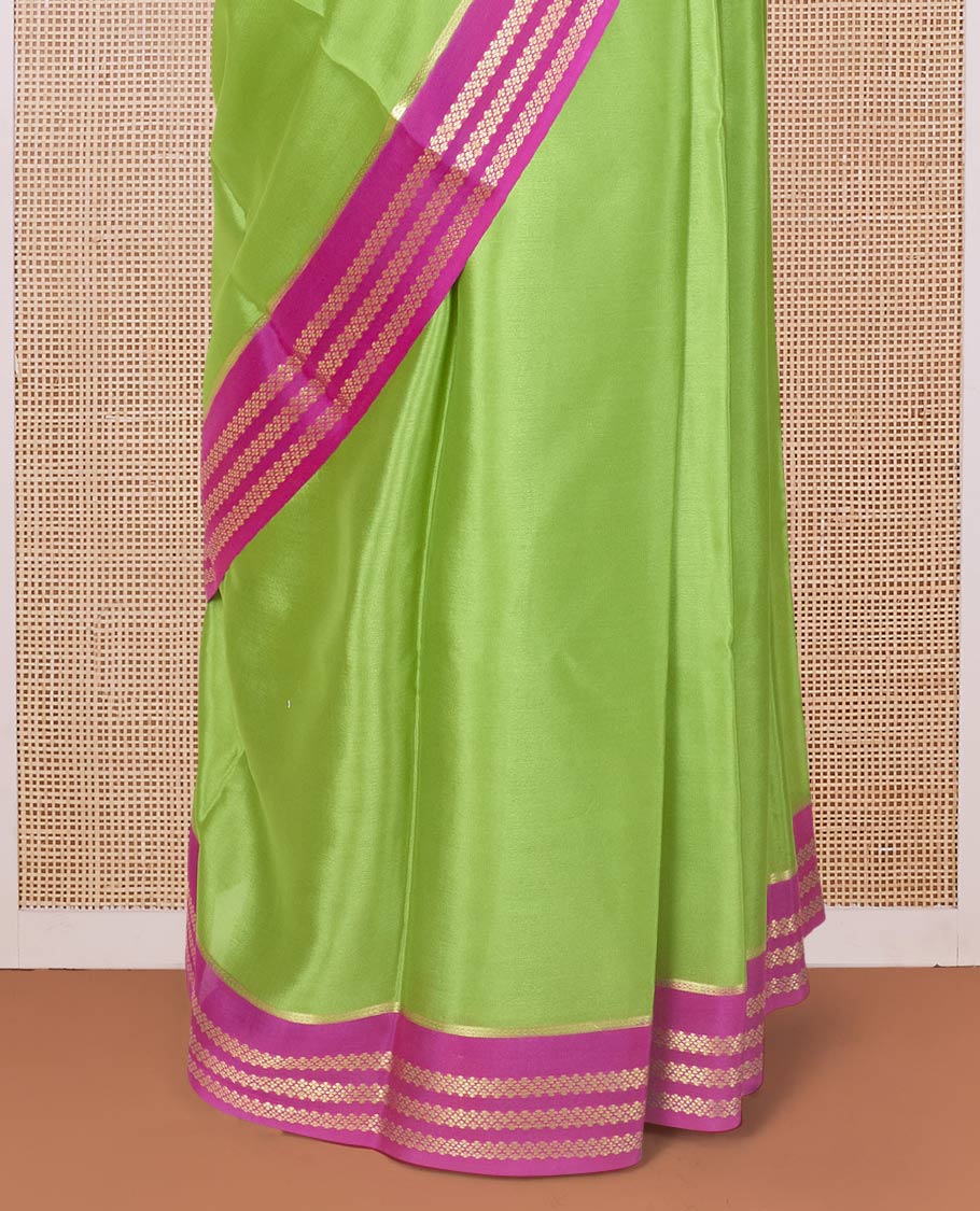 Parrot green plain design Mysore silk saree with contrast rettai pettu borders of zari designs, and zari striped pallu