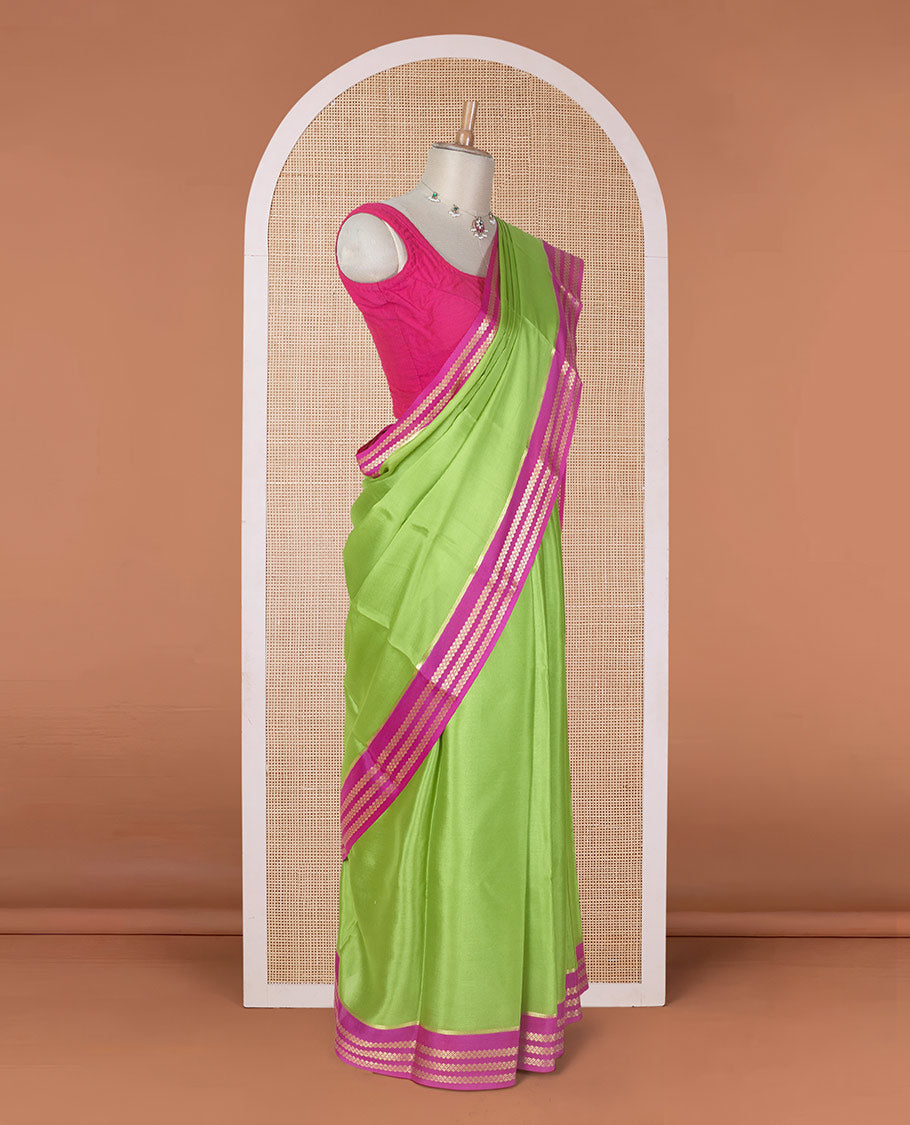 Parrot green plain design Mysore silk saree with contrast rettai pettu borders of zari designs, and zari striped pallu