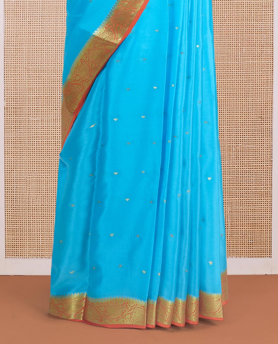 Sky blue zari buttas Mysore silk saree, contrast leaf creeper zari border, and floral zari design palllu