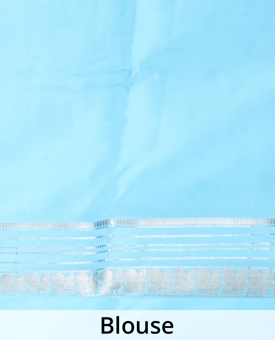 Powder blue manga zari buttas Mysore silk saree, rettai pettu border of peacocks, and pallu steeped with manga motifs