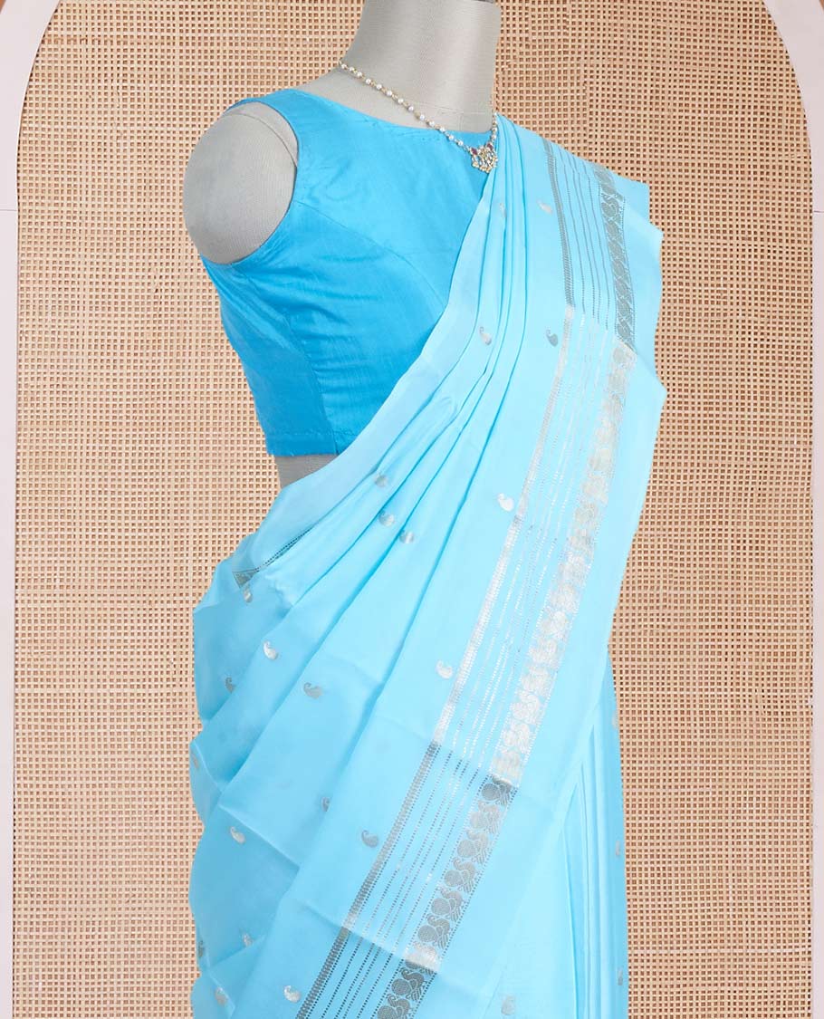 Powder blue manga zari buttas Mysore silk saree, rettai pettu border of peacocks, and pallu steeped with manga motifs