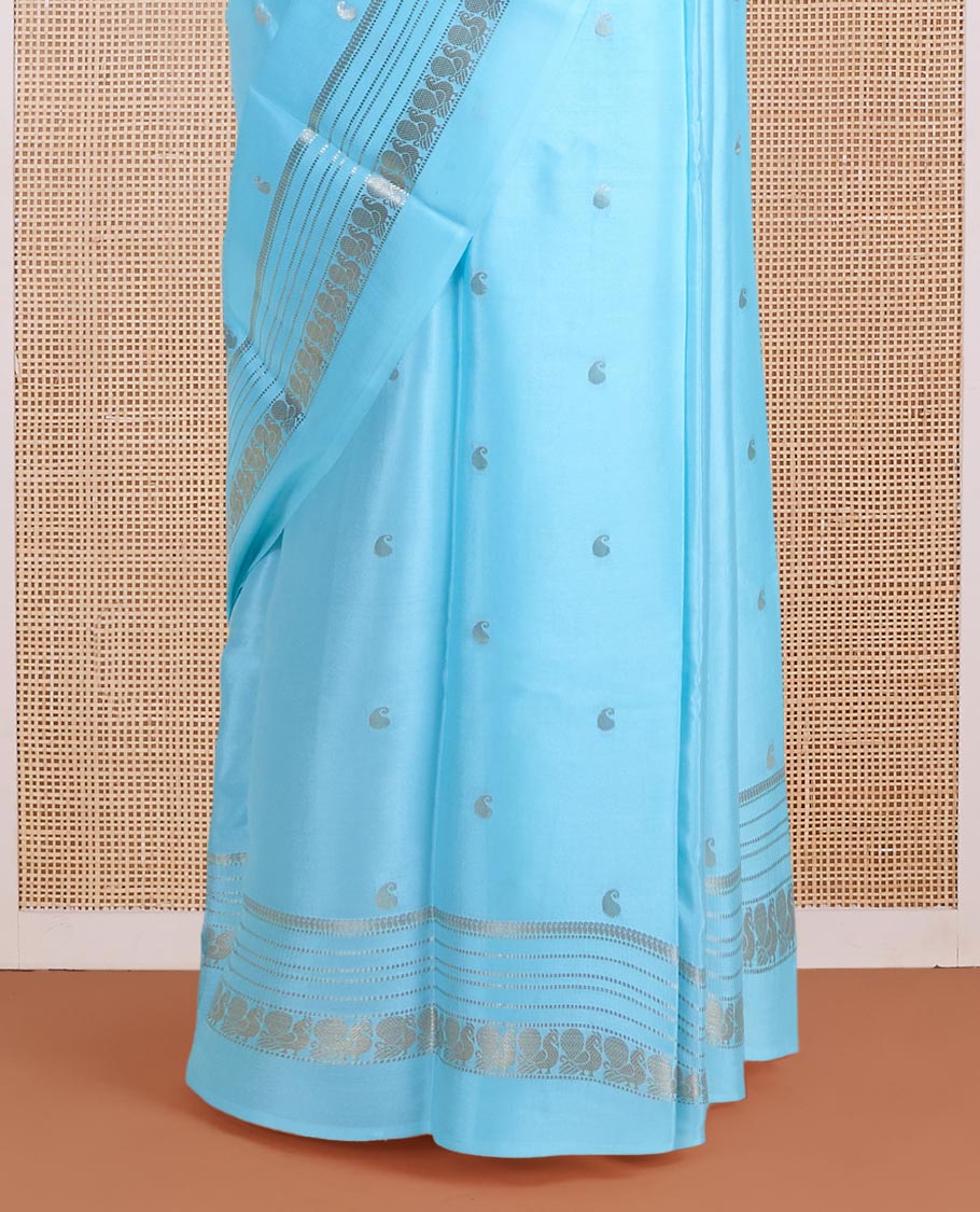 Powder blue manga zari buttas Mysore silk saree, rettai pettu border of peacocks, and pallu steeped with manga motifs
