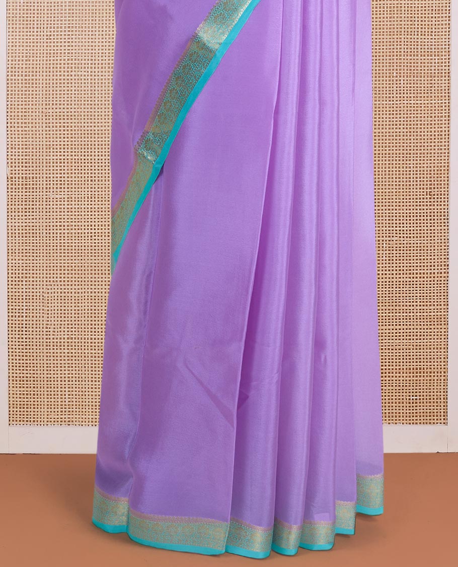 Light lavender plain Mysore silk saree, contrast traditional zari border, and zari striped pallu