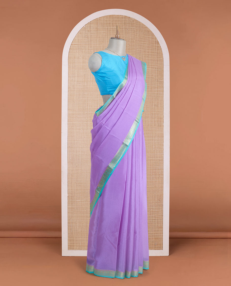 Light lavender plain Mysore silk saree, contrast traditional zari border, and zari striped pallu