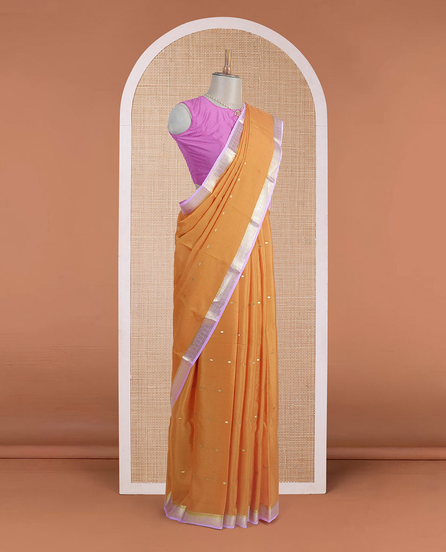 Orange zari buttas steeped Mysore silk saree, contrast traditional zari border, and pallu of zari stripes