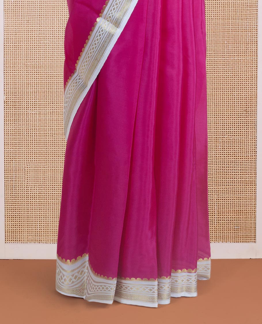 Dark pink plain body Mysore silk saree, contrast border adorned with traditional motifs in zari, and pallu of zari stripes