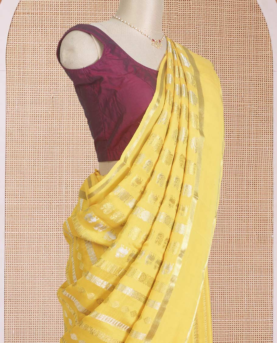 Yellow traditional zari steeped Mysore silk saree, rettai pettu zari border, and intricate pallu