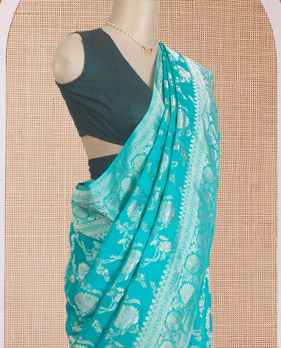 Green floral jaal jacquard fancy crepe saree, floral creeper zari border, and pallu of paisley jaal design